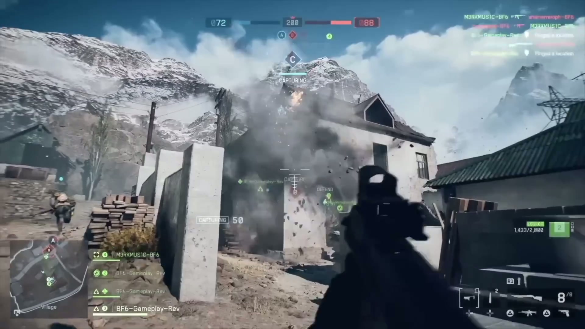 A squad works together, with a medic reviving a downed teammate while others provide cover.