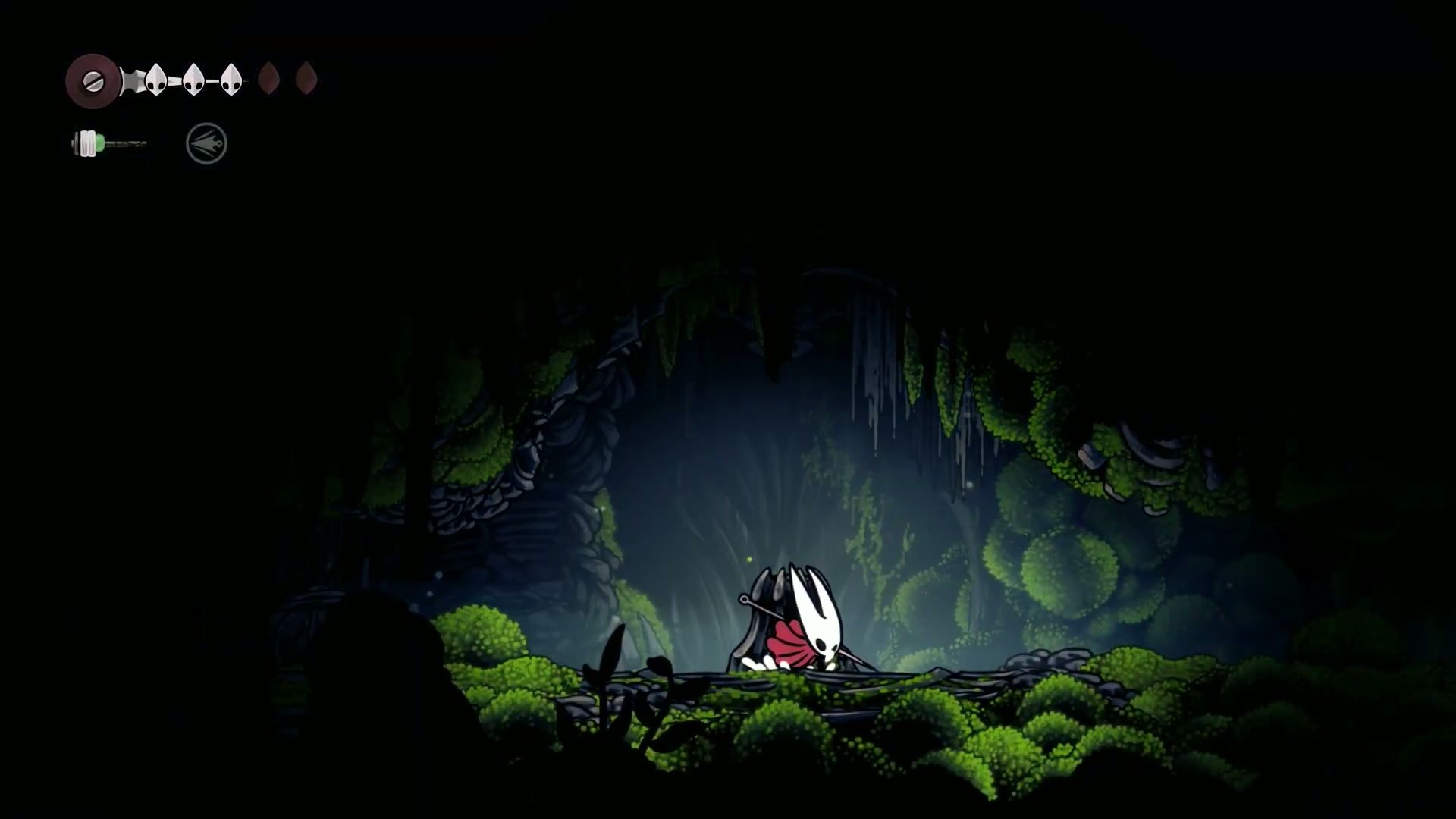 Hornet standing before the secret breakable wall in Moss Home.