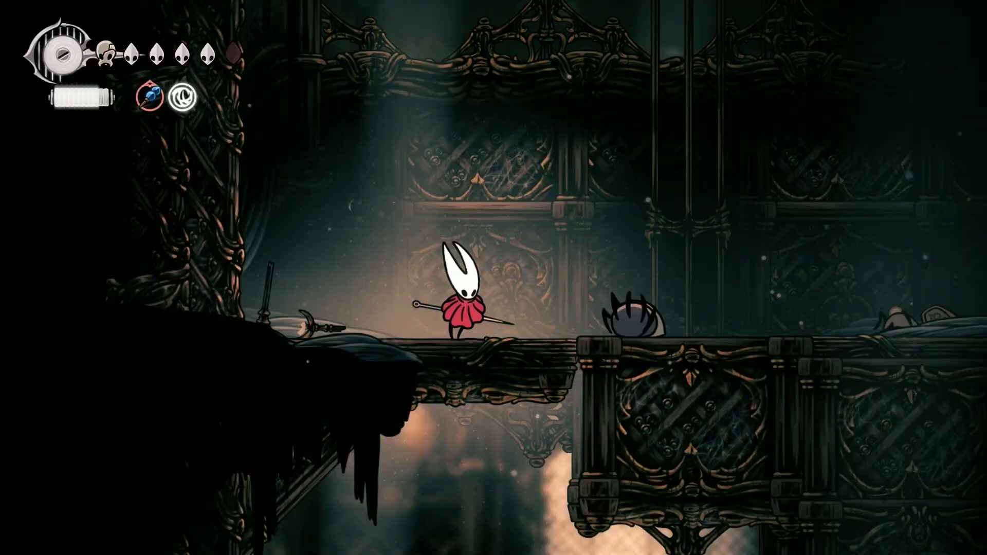Hornet performing a downward dash attack to break a floor switch in Silksong.